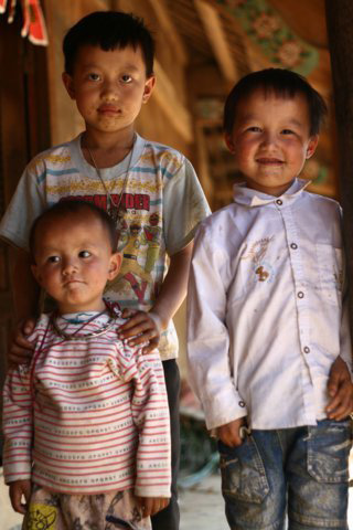 The children are play excitedly on the porch
