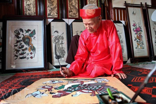Artist in Dong Ho painting village Artist in Dong Ho painting village